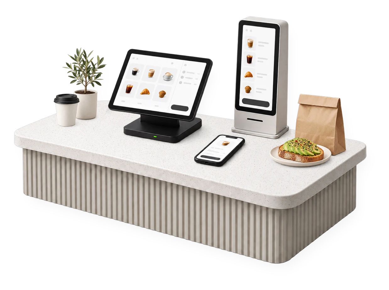 Render 3D de un mostrador de cafetería con Morsis: el POS, el tótem de autoservicio y un celular, con una planta, un vaso de café, una bolsa kraft y una tostada de aguacate